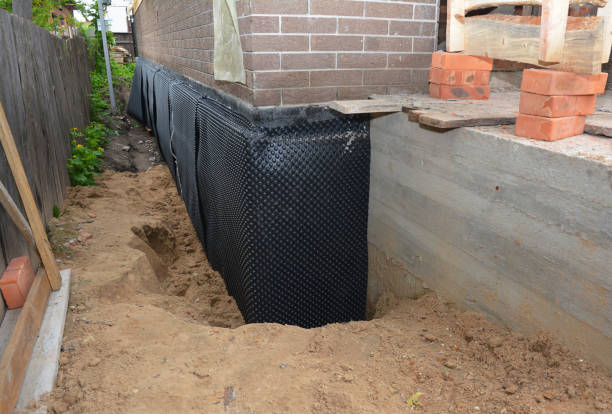 Happy homeowners after waterproofing job in Reedsville